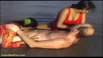 desi indian girls playing with a white tourist at the beach