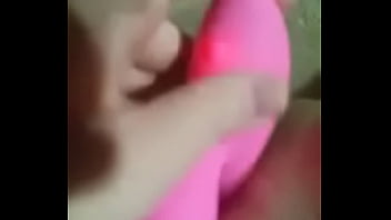 Blonde girl uses a dildo